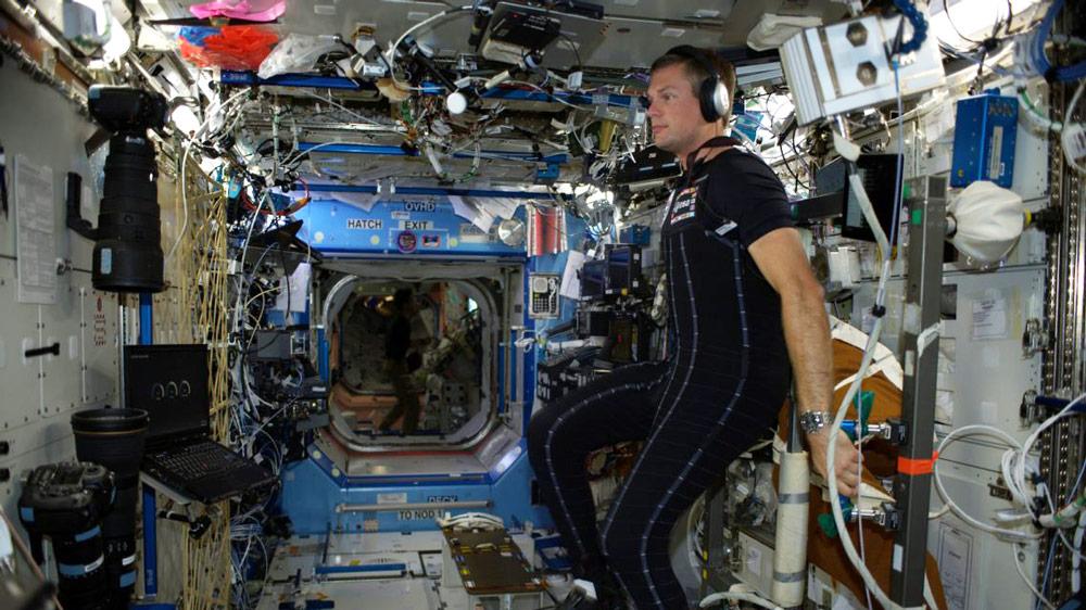ESA astronaut Andreas Mogensen testing the SkinSuit aboard the International Space Station