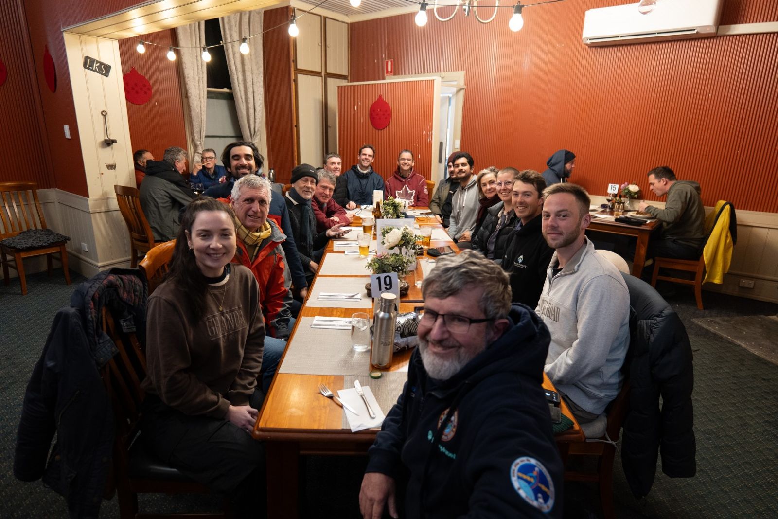 The team around a long dinner table in the Hawker Hotel dining room